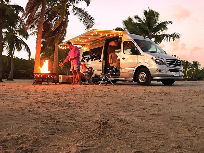Couple Beach Camping with Tommy Bahama Interstate Touring Coach