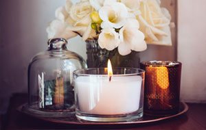 Candles sitting on a copper tray