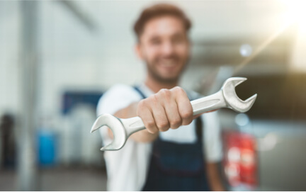 man holding a wrench