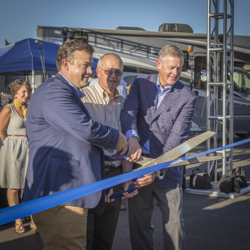 President, Troy Jenkins, dad Tim Jenkins, and Co-Owner Ty Jenkins cutting the ribbon at the grand opening of Bish’s RV in Meridian