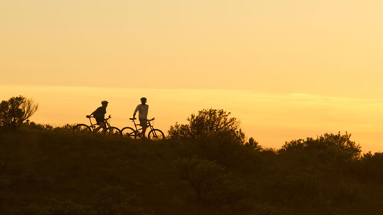 Sunset in Boise Idaho with Bicycle riders in background