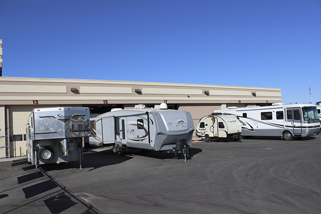 A lineup of RVs in the RV service department lot