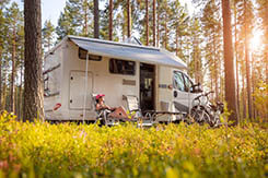 Woman relaxing outside of a motorhome