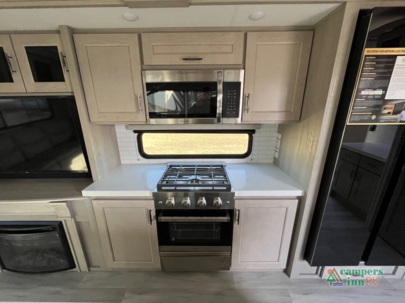 Grand Design RV - Introducing the all new chef-inspired kitchen, featuring  the Insignia Residential Range! ✓ Free-Standing 3.7 CU FT Gas Range ✓4  Burner Cook Top with Cast Iron Grills ✓Electronic Ignition