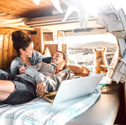 couple smiling at each other in their camper