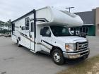 Used 2025 Coachmen RV Freelander 31MB Class C has a molded fiberglass front cap; 21' power patio awning with LED lighting