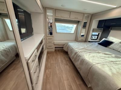 Well appointed private master bedroom with king bed slide in new 2026 Palomino River Ranch 394RKL RV