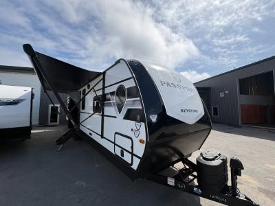 New 2026 Keystone RV Passport 3360BK travel trailer with power tongue jack, stabilizer jacks, and 21' awning