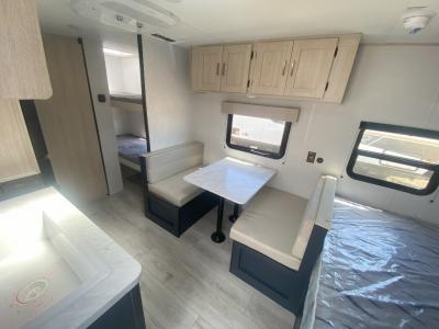 Master bed and bunks at opposite ends of living area in new 2025 Prime Time Avenger LT 16BH RV