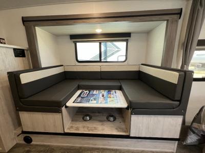 U-shaped booth dinette in extension slide converts to a bed in new 2025 Gulf Stream Vista Cruiser 23QBS RV