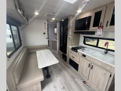 L-shaped dinette and kitchen with quality appliances in new 2026 East to West Della Terra 250QB RV