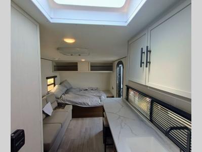 Living space with kitchen and sleeping area in new 2026 Prime Time Avenger LT 17RK RV