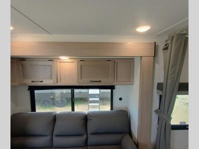 Jack knife sofa and overhead cabinets in living area slide in new 2026 Gulf Stream Conquest Ultra Lite 20RBS RV
