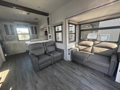 Spacious living area with pull out sofa and theater seats in new 2026 East to West Ahara 395FB RV