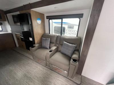 travel trailer 2025 Coachmen Freedom Express Ultra Lite 22MLS theatre seating