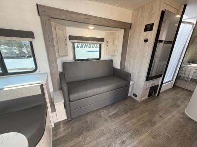 Sofa in extension slide converts to a bed  in new 2026 Gulf Stream Vista Cruiser 23RSS RV