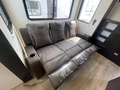 Reclining sofa in living room slide in new 2025 Forest River Vengeance Rogue 32SUT RV
