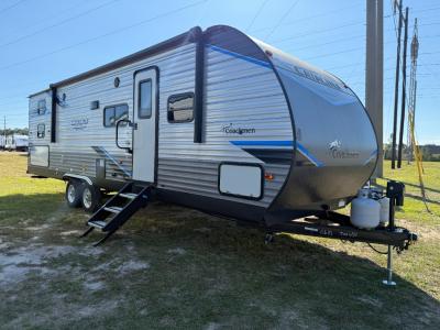 Used 2022 Coachmen Catalina Legacy 293QBCK travel trailer with 18' electric awning with multicolored LED lights on remote
