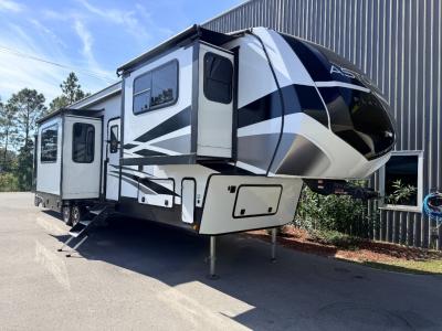 Front /side view of used 2025 Dutchmen Astoria 3803FLP fifth wheel with extended slides