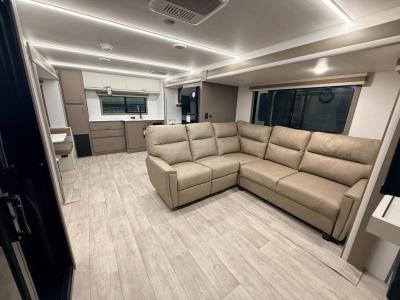 Spacious living area with trifold sofa plus sofa with recliners in  new 2026 East to West Alta 3175RK