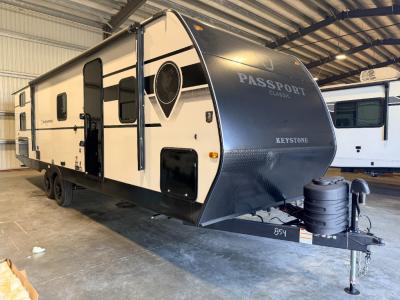 Power awning over door and most of side of new 2026 Keystone Passport Classic 284QB travel trailer