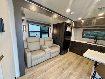 Theater-style leather seating facing SmartTV (included)