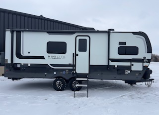 RV has strut assisted steps