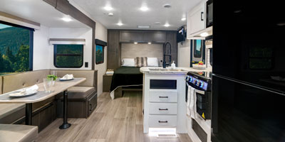 View from rear to front bedroom, kitchen and dinette area