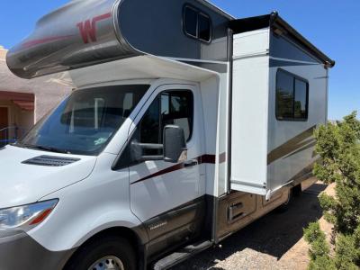 Driver's side view with slide out and awning topper