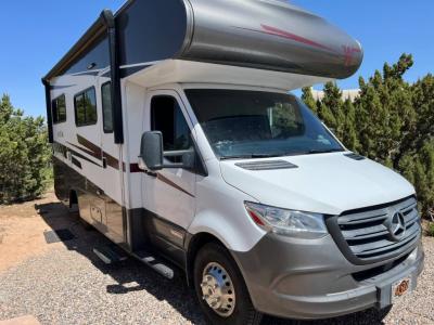 Passenger side view with 15' power awning and radial tires
