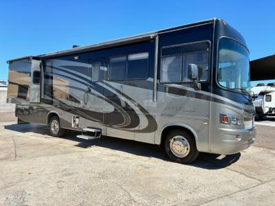 Passenger side view with bedroom slide out and power awning
