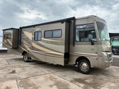 Passenger side view with two slide outs both with awning cover