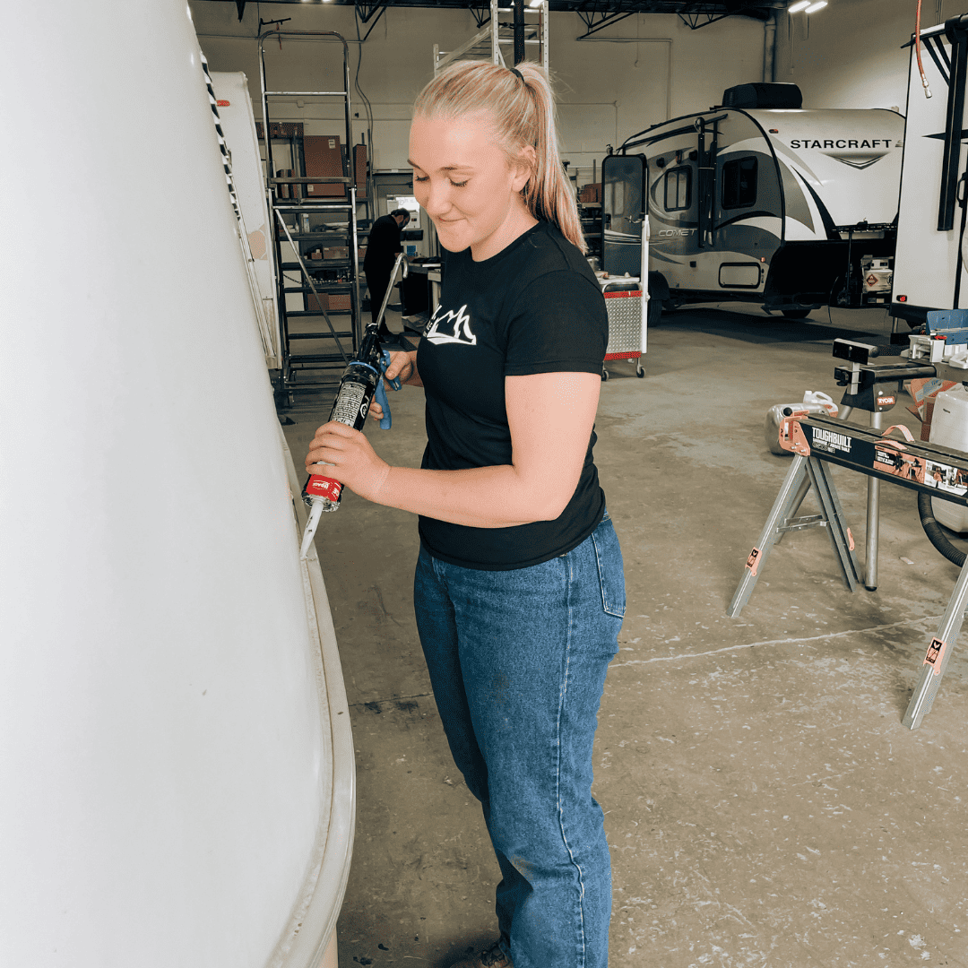 Woman working on RV