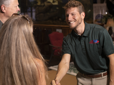 Salesman shaking hands with customer
