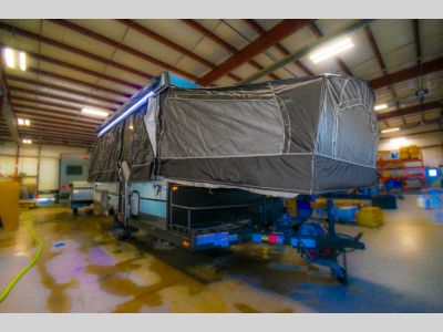 Front Exterior View: Front angle of the pop-up RV with sleek and compact design.