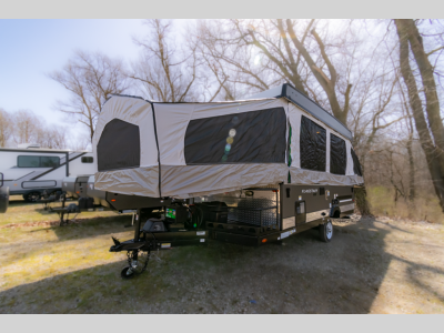 Side exterior view of the 2024 Forest River Flagstaff SE 228BHSE with its tent extensions fully open, ideal for camping.