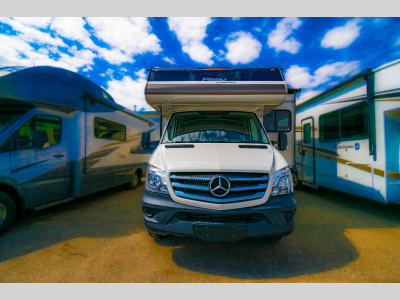 Front view of the motorhome showing the Mercedes-Benz Sprinter chassis and front grille.