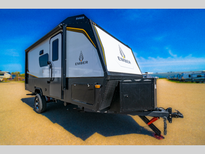 Front angle of the 2022 Ember 170MBH travel trailer with off-road tires and large front window.