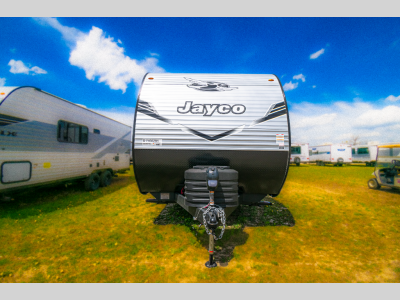 Straight-on front view with propane tanks and front jack visible.