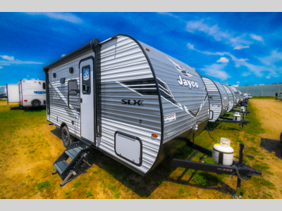 Front three-quarter view of the 2025 Jayco Jay Flight SLX 175BH travel trailer parked on grass
