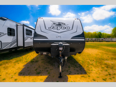 Front exterior view showing propane tanks and power tongue jack beneath the Jayco logo.