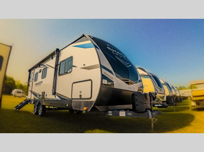 Another angled exterior shot of the 2022 Cruiser Shadow Cruiser 225RBS under natural lighting