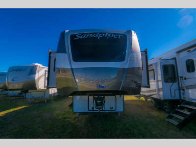 Front view showcasing the RV's hitch and design.