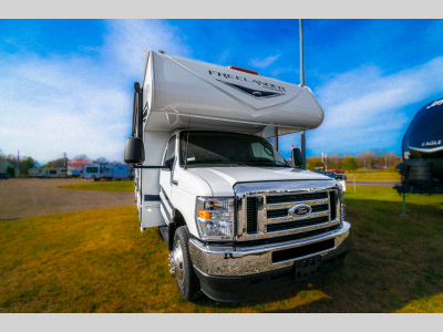 Side view of the Freelander 23FS showcasing its streamlined design and large over-cab sleeping area.