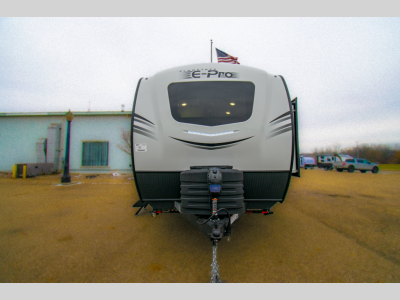 Front view of the RV showcasing the hitch and front cap.