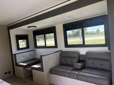 Main living area with booth dinette and sofa seating