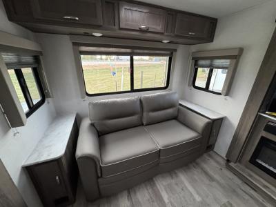 Overhead storage and large windows for optimal lighting