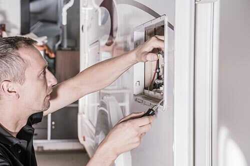 Technician working on RV electrical