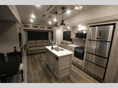 New RV Kitchen With Kitchen Island, Sofa and Dinette