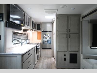 New East to West Travel Trailer Kitchen and TV